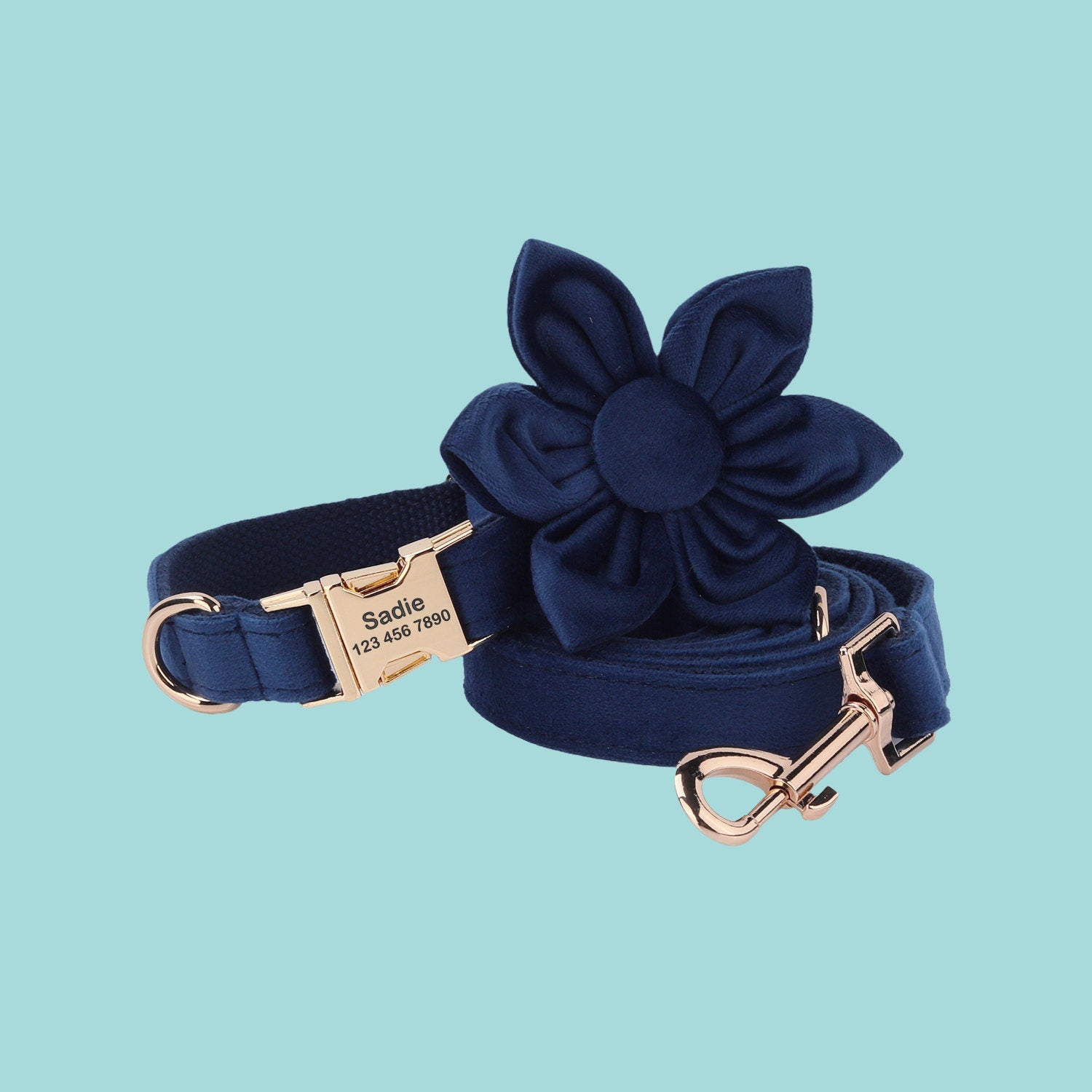 a blue dog leash with a bow on it