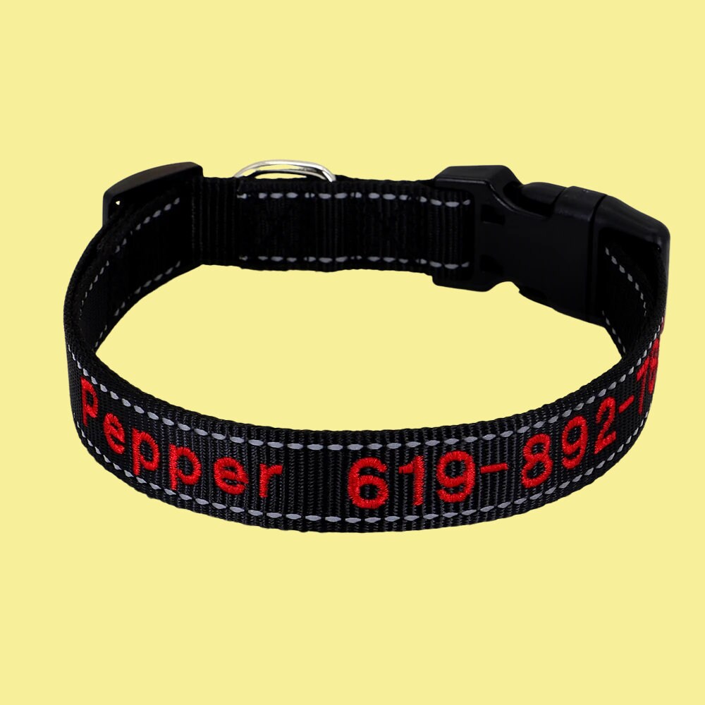 a black collar with red letters on it